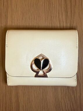 Kate Spade Cream Leather Compact Wallet with Spade Heart Emblem